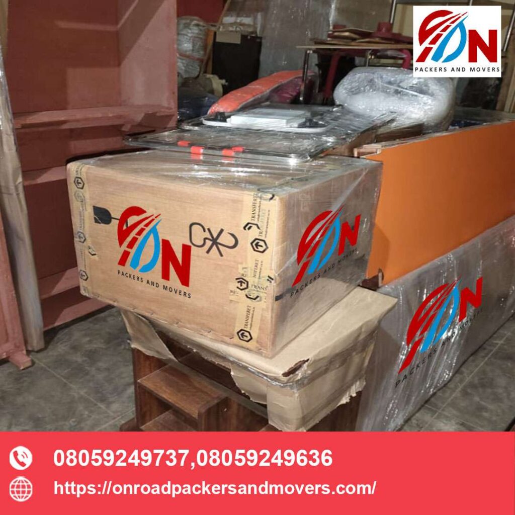 a on road packers and movers bangalore carton box tighly packed with a symbol stating it contains glasses.